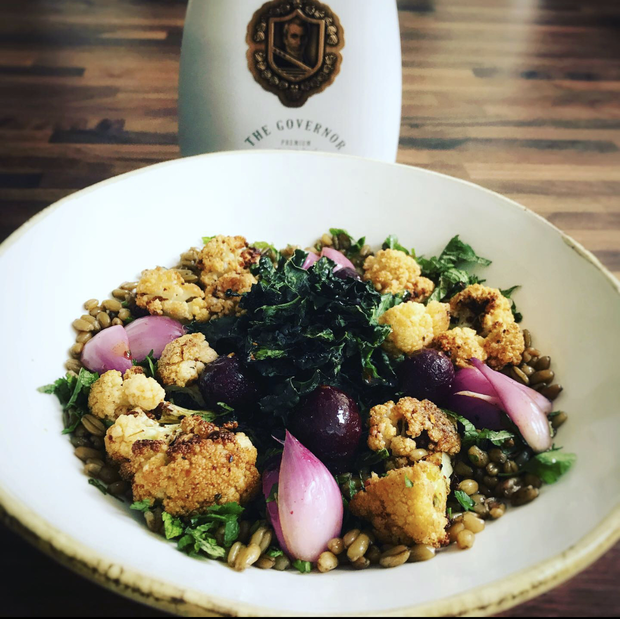 Roasted cauliflower, crispy kale & freekeh salad with a black garlic dressing